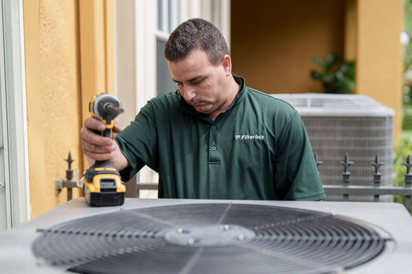 Best HVAC installation services company in Stuart FL - A picture of Filterbuy HVAC technician doing an HVAC installation service in Stuart FL